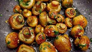 Mushrooms with garlic are tastier than meat Fried champignons in a pan