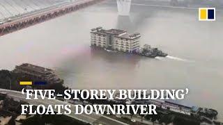 Floating restaurant drifts downriver in Chongqing China