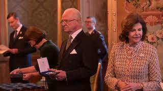 Veronica Maggio reciving a medal from  King Carl Gustaf and Queen Silvia