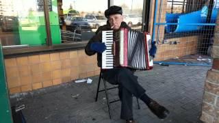 Old Russian man playing the accordion