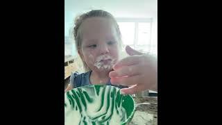 Girl Loves Eating Yogurt as It Covers Her Entire Mouth