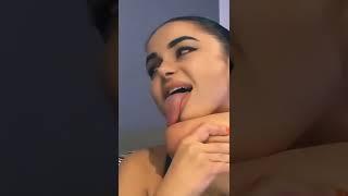 the longest tongue. the girl shows a tongue. the girl sticks out her tongue. the girls long tongue