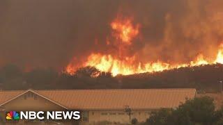 State of emergency expands as western fires spread