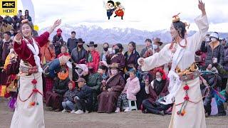 The Tibetan dance under the snow mountain is beautiful and cheerful