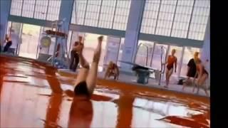 Female swimmer stuck kicking and struggling in red gelatin swimming pool