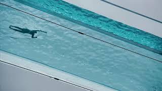 Watch a swimmer in Londons fully transparent Sky Pool