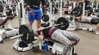 Female bench presses 225lbs for reps