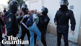 Riot police in Russia punch a women in stomach during a protest for free elections