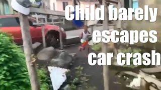 Child barely escapes car crash