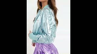 Model wearing Ellesse shiny nylon bomber jacket and skirt