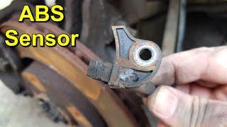 Cleaning or Replacing the Front ABS Wheel Speed Sensor - Peugeot 307