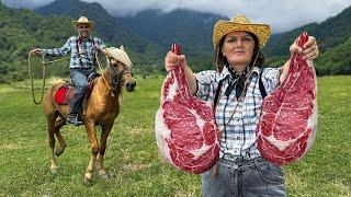 Tomahawk Ribeye Marble Steaks Roasting on Open Fire Outdoors Cooking in the Beautiful Mountains