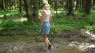 Girl walks barefoot in a deep mud muddy feet dirty feet girl in mud walking in mud scene 513