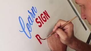 Brush lettering with enamel paint on tracing paper