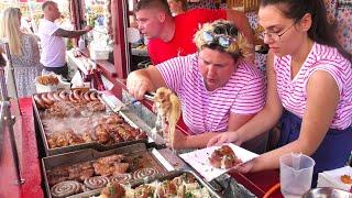 Street Food in Gdansk Poland. Sausages Grilled Meat Pork Steaks Wrap Langos Kurtos Pizza