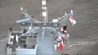 HMS Ocean sails through the Thames Barrier to Greenwich - YouTube.flv