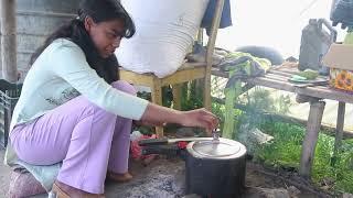 village girl cooking fried rice with tomato chatni spicy in traditional firewood