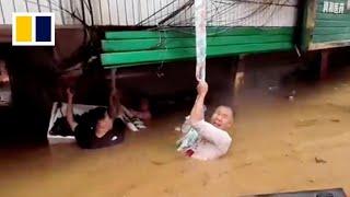 ‘Save her first’ Chinese man keeps pregnant wife above water for 3 hours in floods