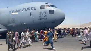 Watch Afghans Run Alongside U.S. Military Plane At Kabul Airport