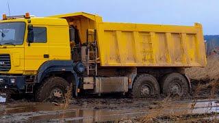 Cargo transportation through mud off road  Heavy equipment works off road