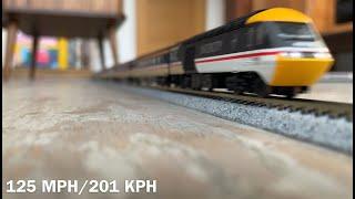 Model trains running at scale speed