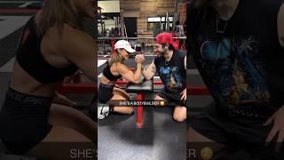 Arm wrestling a female bodybuilder 