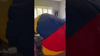 Trying to blow up the WORLDS BIGGEST beach ball... In my own bedroom.