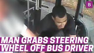 Scary CCTV shows man trying to grab wheel off bus driver before being arrested