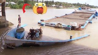 706 The powerful wooden boat pulled the barge through the dams gate