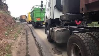 Cycling close to lorries ramp of Mai Mahiu  Kenya