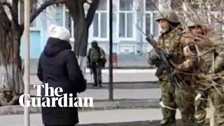 Ukrainian woman offers seeds to Russian soldiers so sunflowers grow when they die