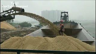 Large barge loading and unloading 5000 tons of sand 