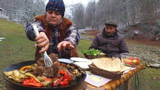 T-bone Steak with Vegetables Cooking on the Sadj