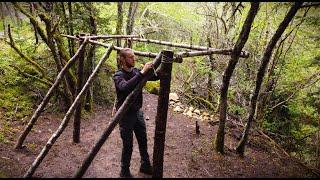 Building bushcraft survival shelter in the woods  Part 1 - Base camp