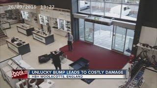 Customer in England bumps into TV display causing domino effect