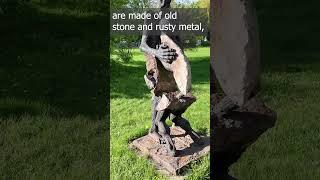 Guys made of old stone and rusty metal