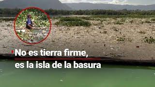 Surge isla de basura en el Lago Amatitlán en Guatemala se convierte en vertedero de residuos