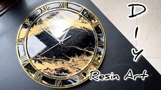 DIY  Epoxy resin wall clock. Black and gold. Resin Art.