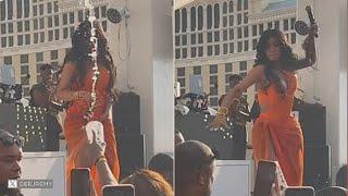 Drink tossed at Cardi B on stage - she fires back with her microphone