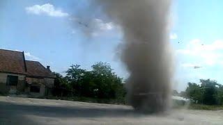 Mini tornado dust devil hits truck in parking lot