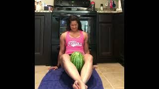 Strong Female Bodybuilder Cracking watermelon