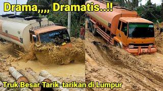 Dramatic dramatic big truck tug in the mud