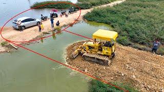 Whole video It is impressive that the KOMATSU Dozer crew can even pour stone to create water road