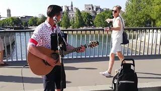 A busker sings Queen when suddenly a passerby begins to dance  Roman Roses