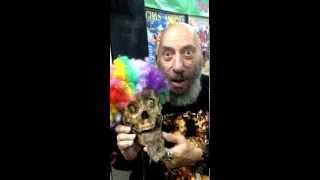 SID HAIG and a clown corpse sign at Girls and Corpses booth at ScareLA