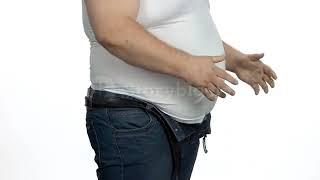 videoblocks caucasian man with big belly side view fat man trying to put on his tight jeans effect o