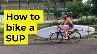 Transporting a stand-up paddle board with a bicycle rack bike + SUP