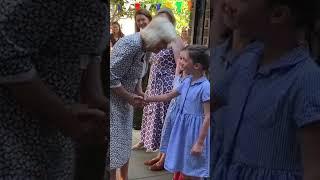 Cute moment girls curtsy for Queen Camilla