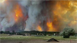 Two people dead as New Mexico wildfires rage