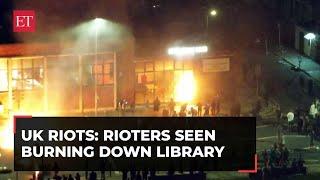 UK riots Bodycam footage shows police pelted with fireworks rioters burn down library